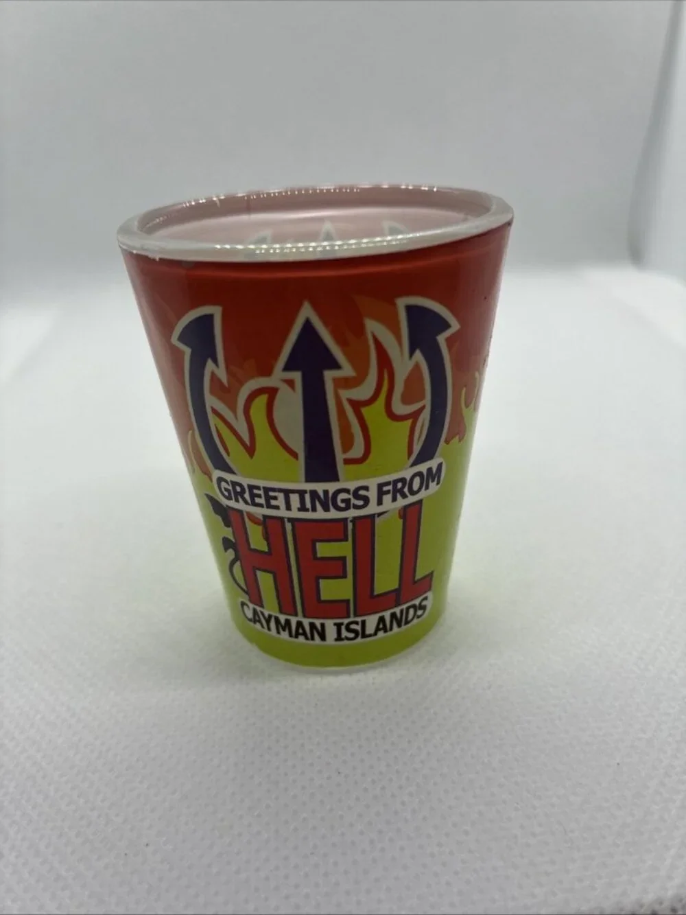 Vintage Greetings From Hell Cayman Islands Shot Glass Souvenir Red Green Flames